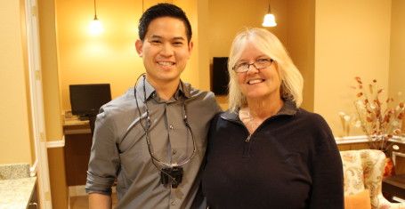 Dr. Do takes photo with patient